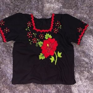 Black blouse with red - bordered red flowers